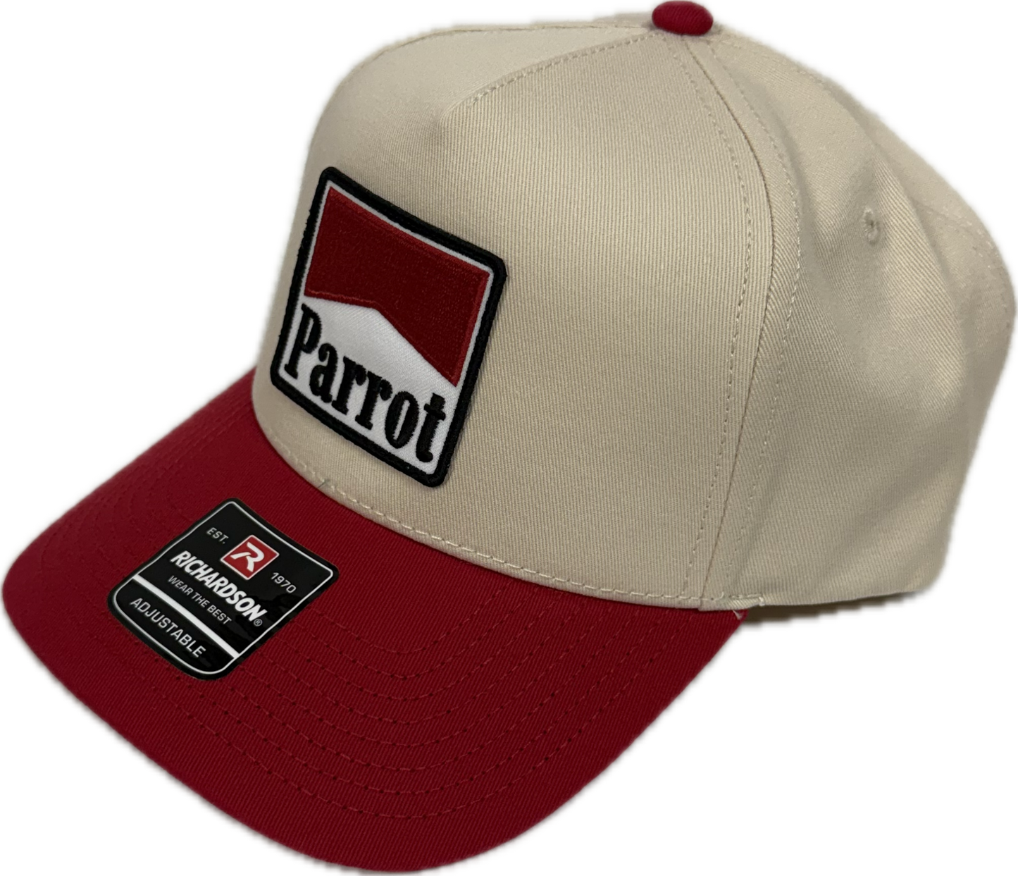 Parrot Surf Shop cream and red snapback hat with Parrot logo patch and curved brim offered by Parrot Surf Shop