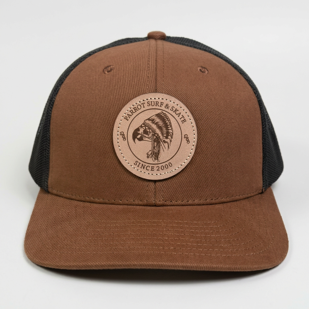 Parrot Surf & Skate 112LN Indian Trucker hat in Autumn/Brown with leather Indian patch, front view - Parrot gear