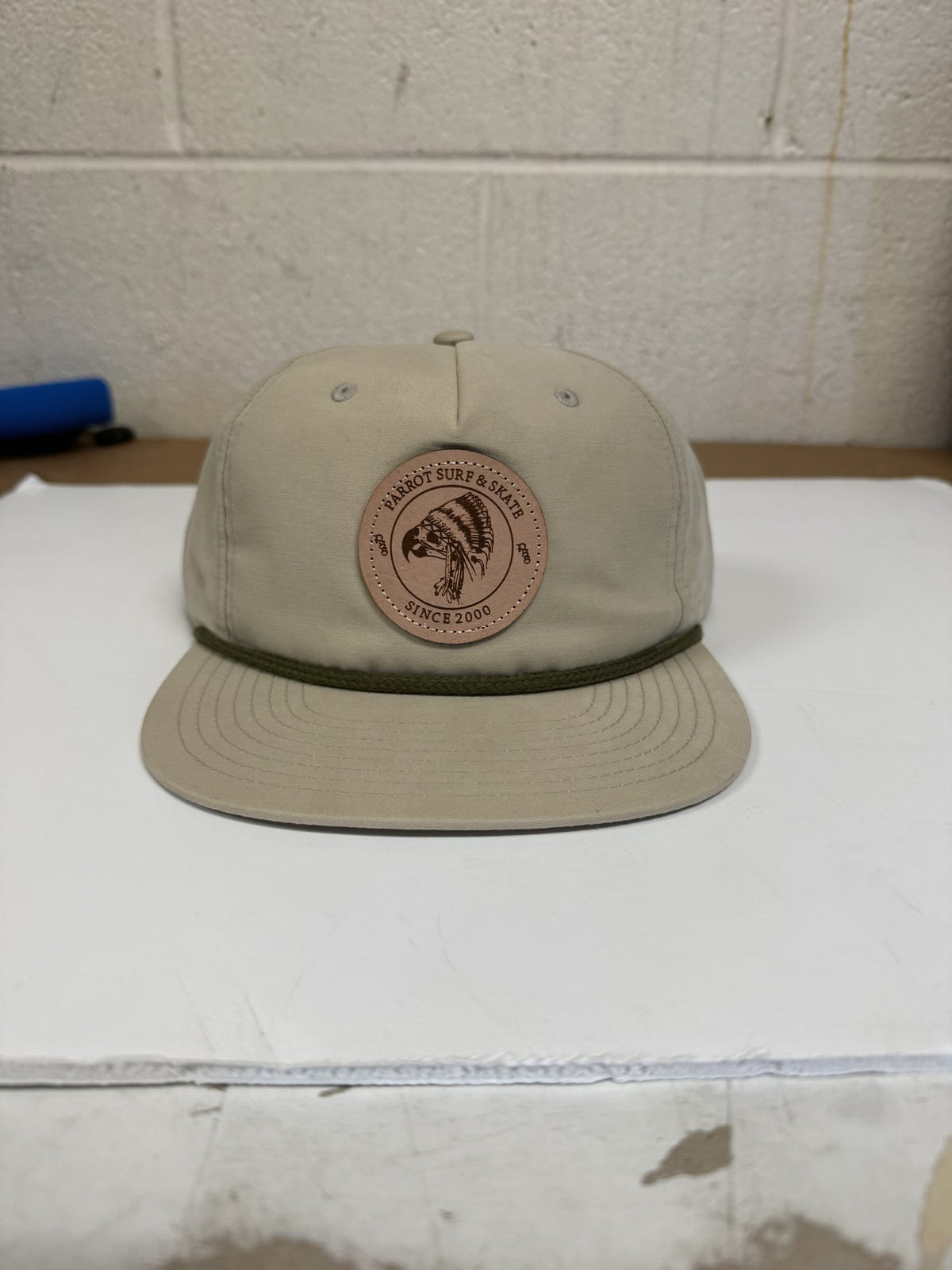 Parrot Surf & Skate 256 Indian Rope hat in Umpqua Sand Dune with loden rope and leather Indian patch, front view - Parrot gear