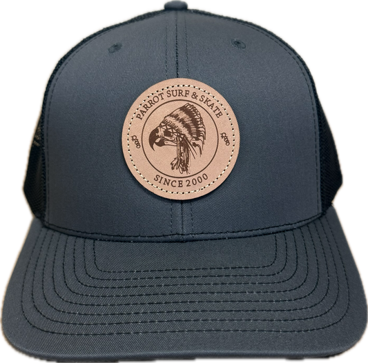 Parrot Surf & Skate 112 Indian Trucker hat in Charcoal/Black with leather Indian patch, front view - Parrot gear