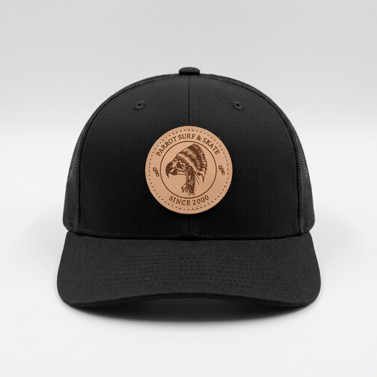 Parrot Surf & Skate 112LN Indian Trucker hat in Black with leather Indian patch, front view - Parrot gear