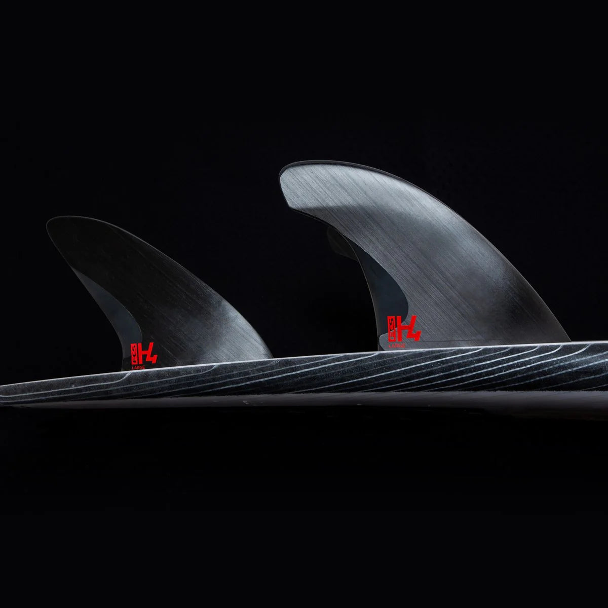 FCS II H4 Swiss Tri Fin Set Small installed on surfboard view