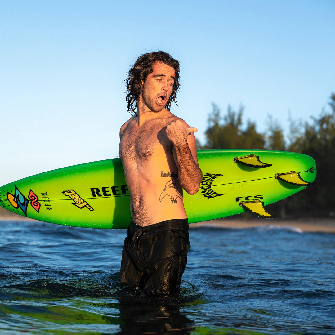 FCS II Mason Ho PC Tri Fin Set installed on surfboard view
