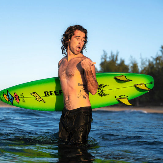 FCS II Mason Ho PC Tri Fin Set installed on surfboard view