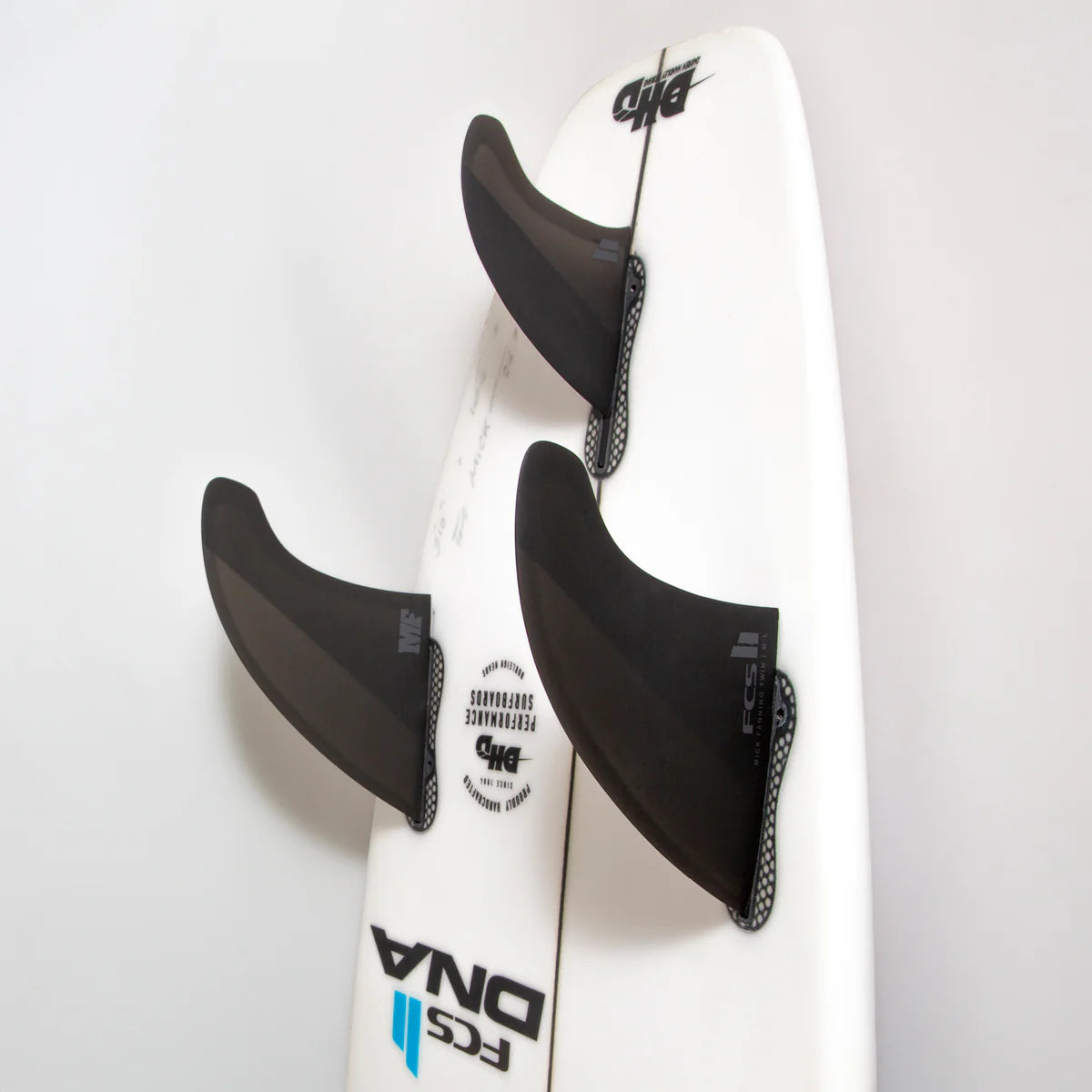 FCS II Mick Fanning Twin + 1 PC Fin Set installed on surfboard