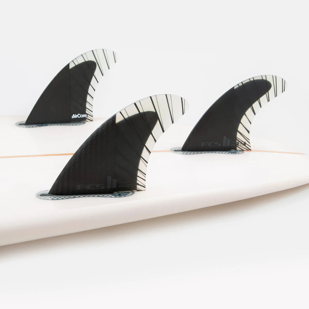 FCS II Reactor PCC Tri Fin Set installed on surfboard view