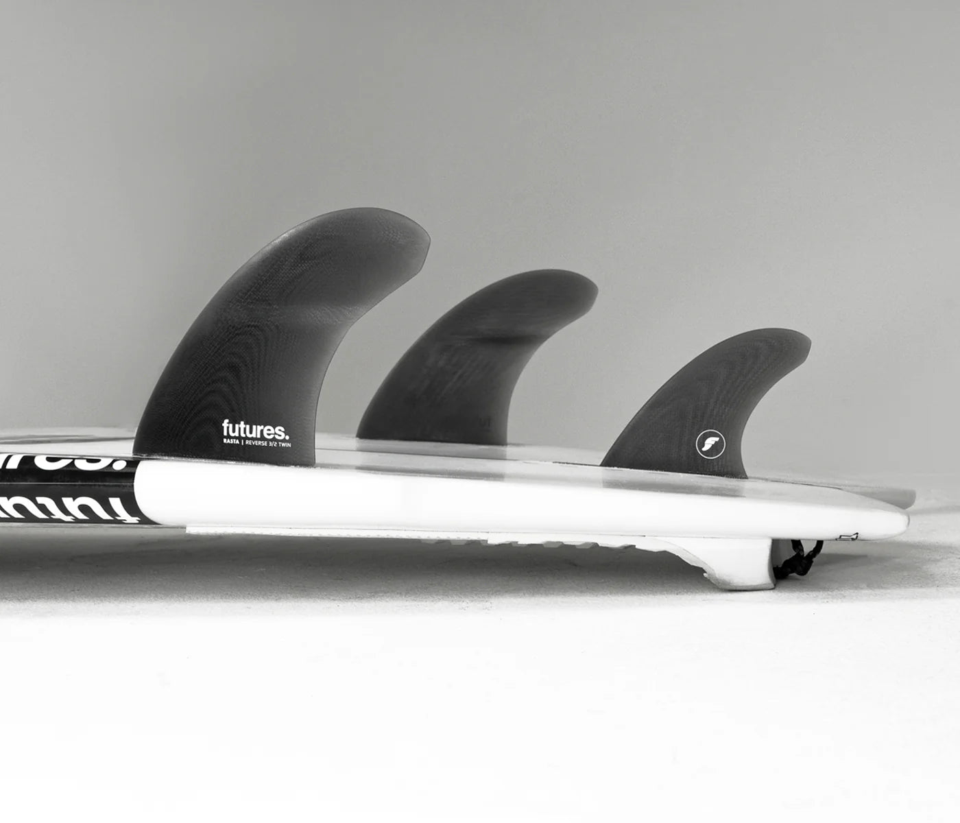 Rasta FG Reverse 3/2 Twin + 1 Futures Fins installed on surfboard view