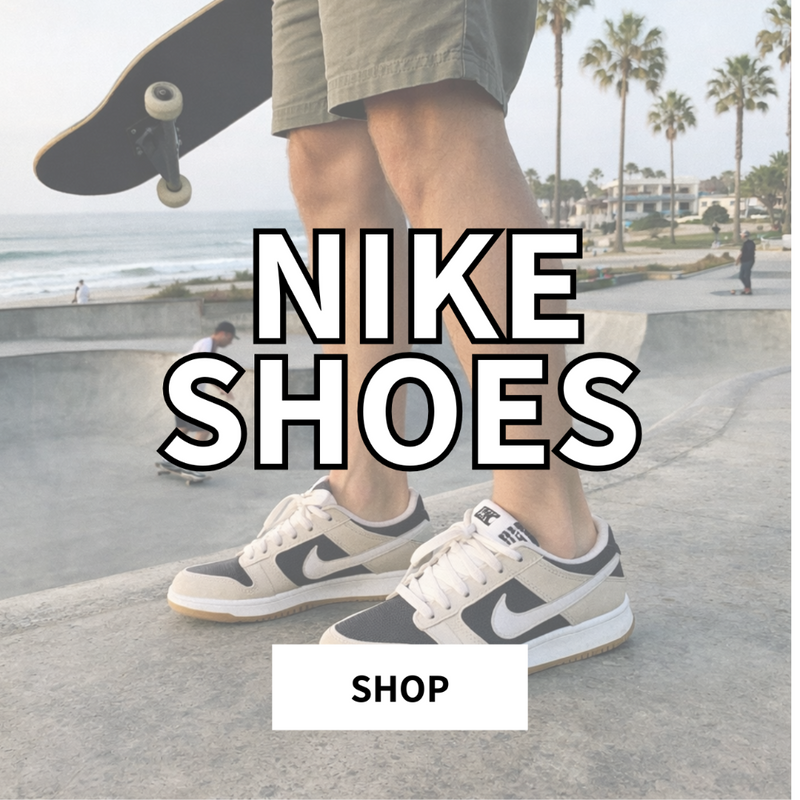 Skater walking along a coastal street at golden hour wearing black and white Nike skate shoes near the ocean