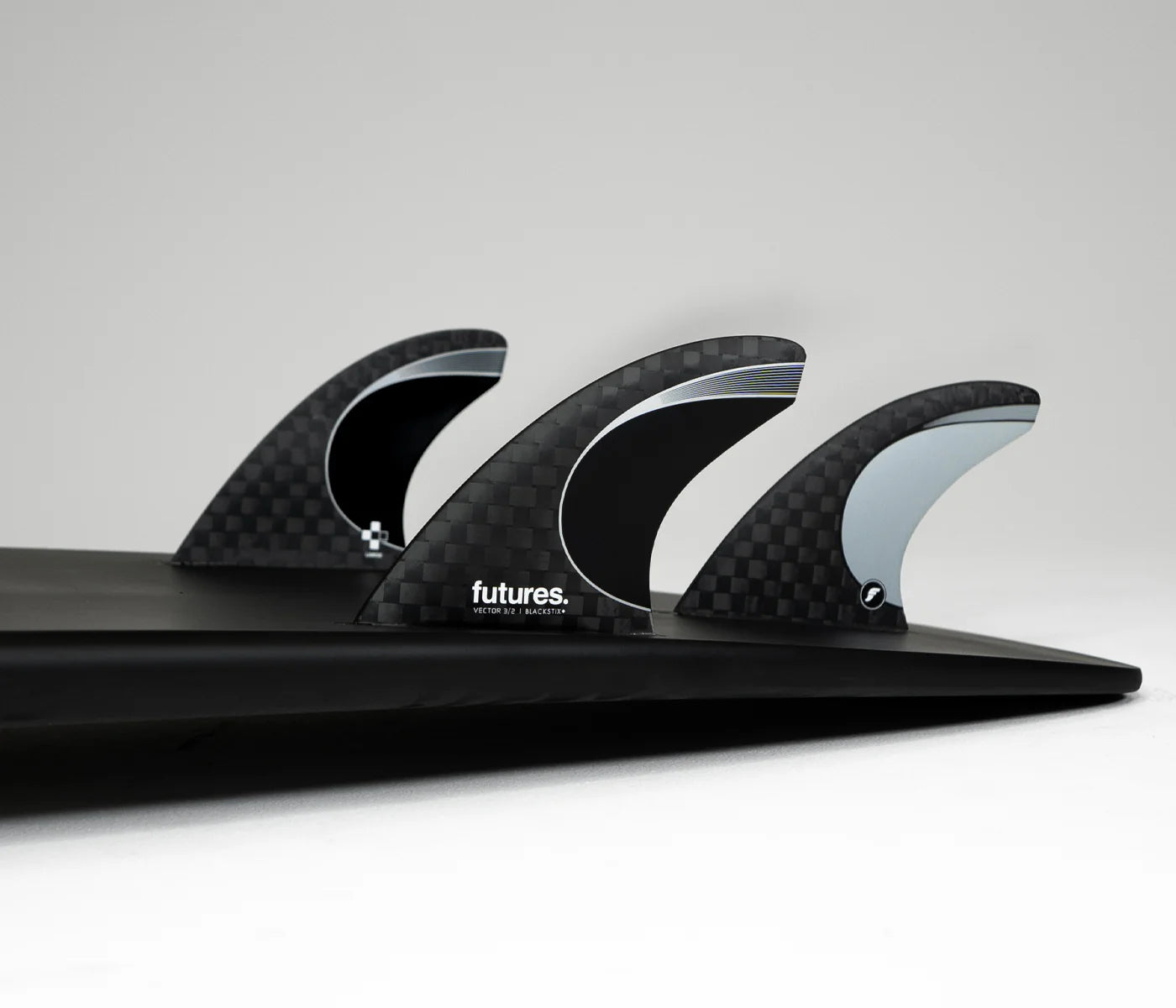 Vector 3/2 Blackstix+ Thruster Large Futures Fins installed on surfboard view